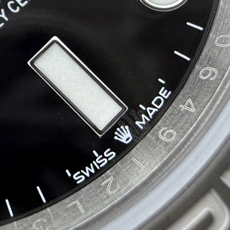 Close-up detail of a Clean Factory Submariner-style watch showing dial and bezel finishing